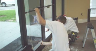 A1 Doors technician installing a commercial storefront door