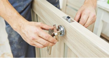Technician repairing a door