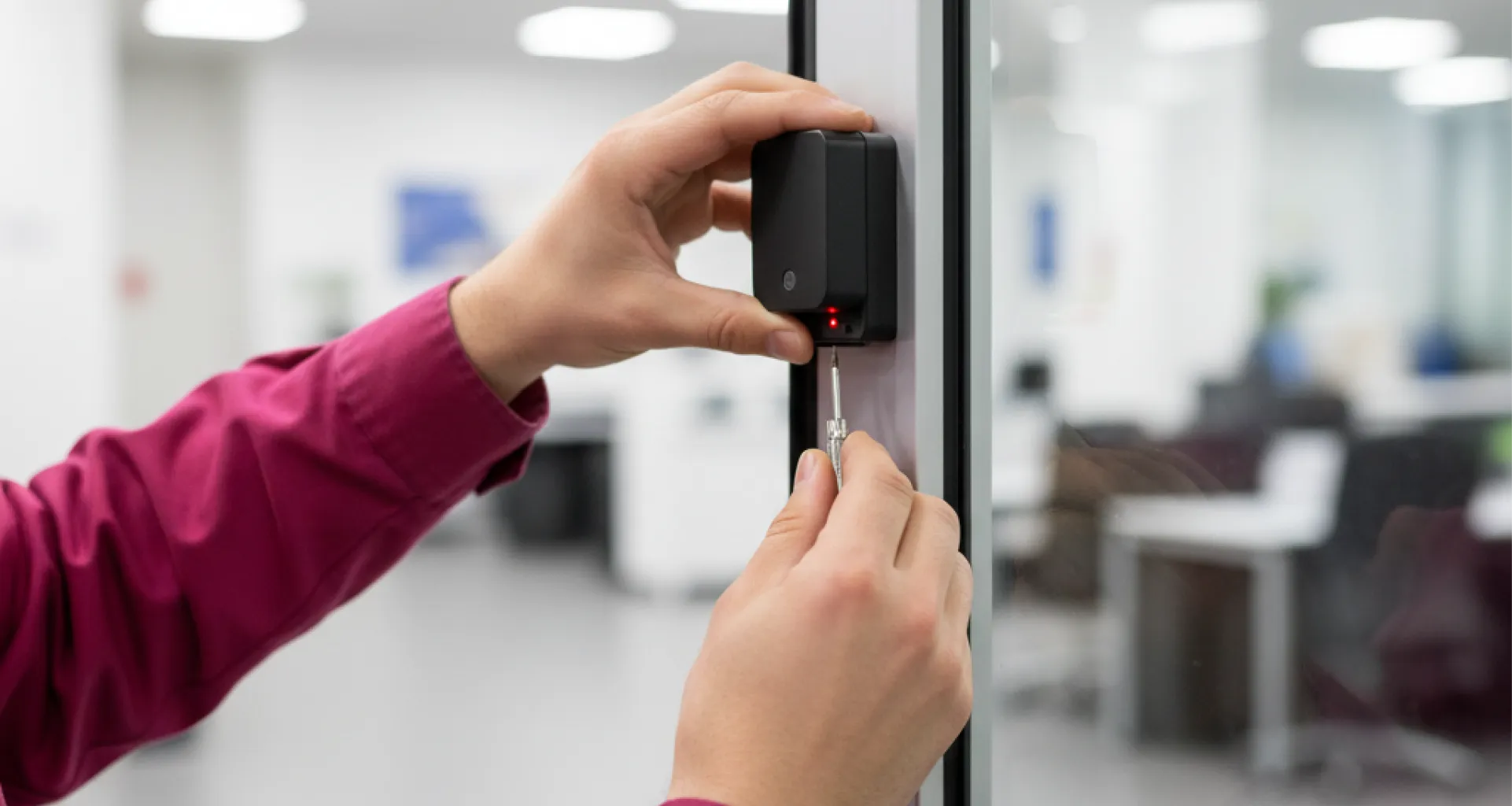 technician-aiming-automatic-door-safety-sensor